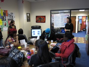Michelle T. Sterling lends her time educating young women on the importance of make-up application.