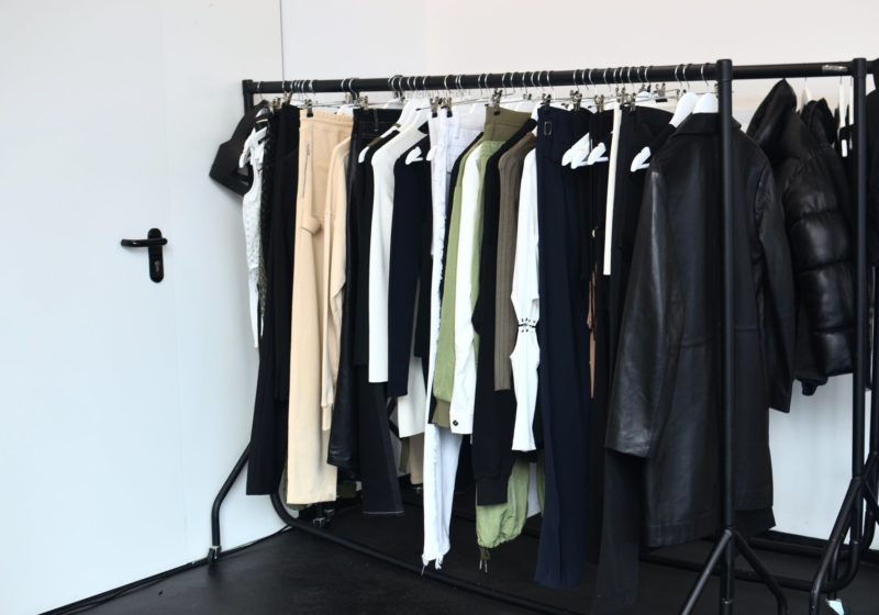 collection of garments hanging on rack