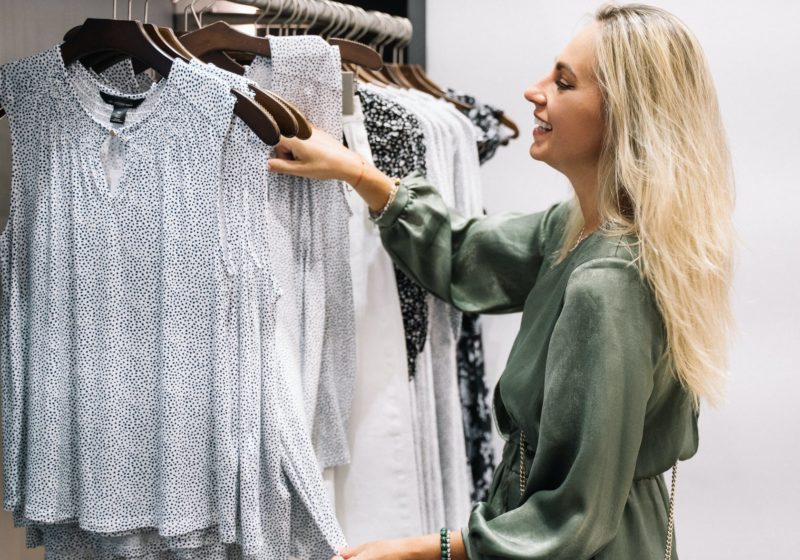 happy woman purchasing clothes