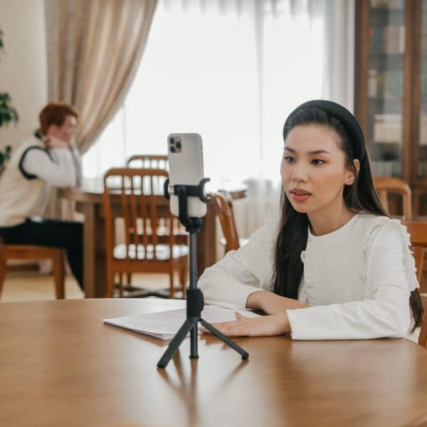 vlogger in front of a smartphone on a tripod