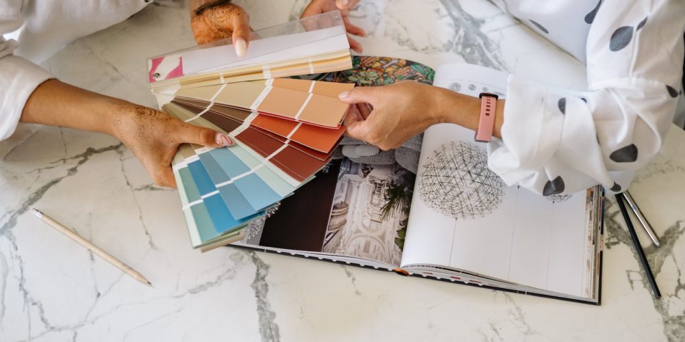 women holding a sample color chart