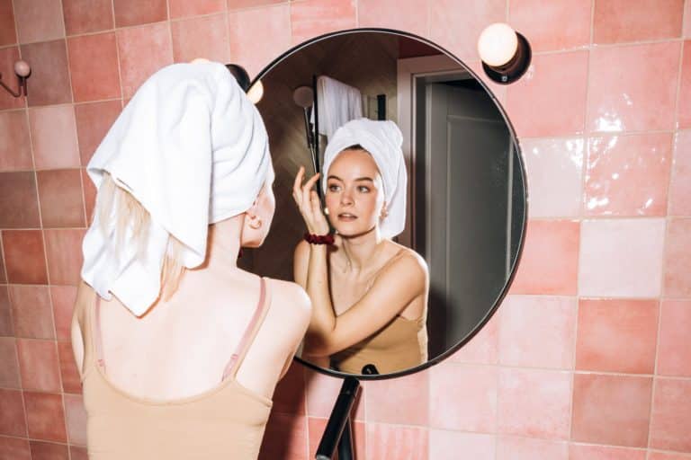young woman doing her facial skin care