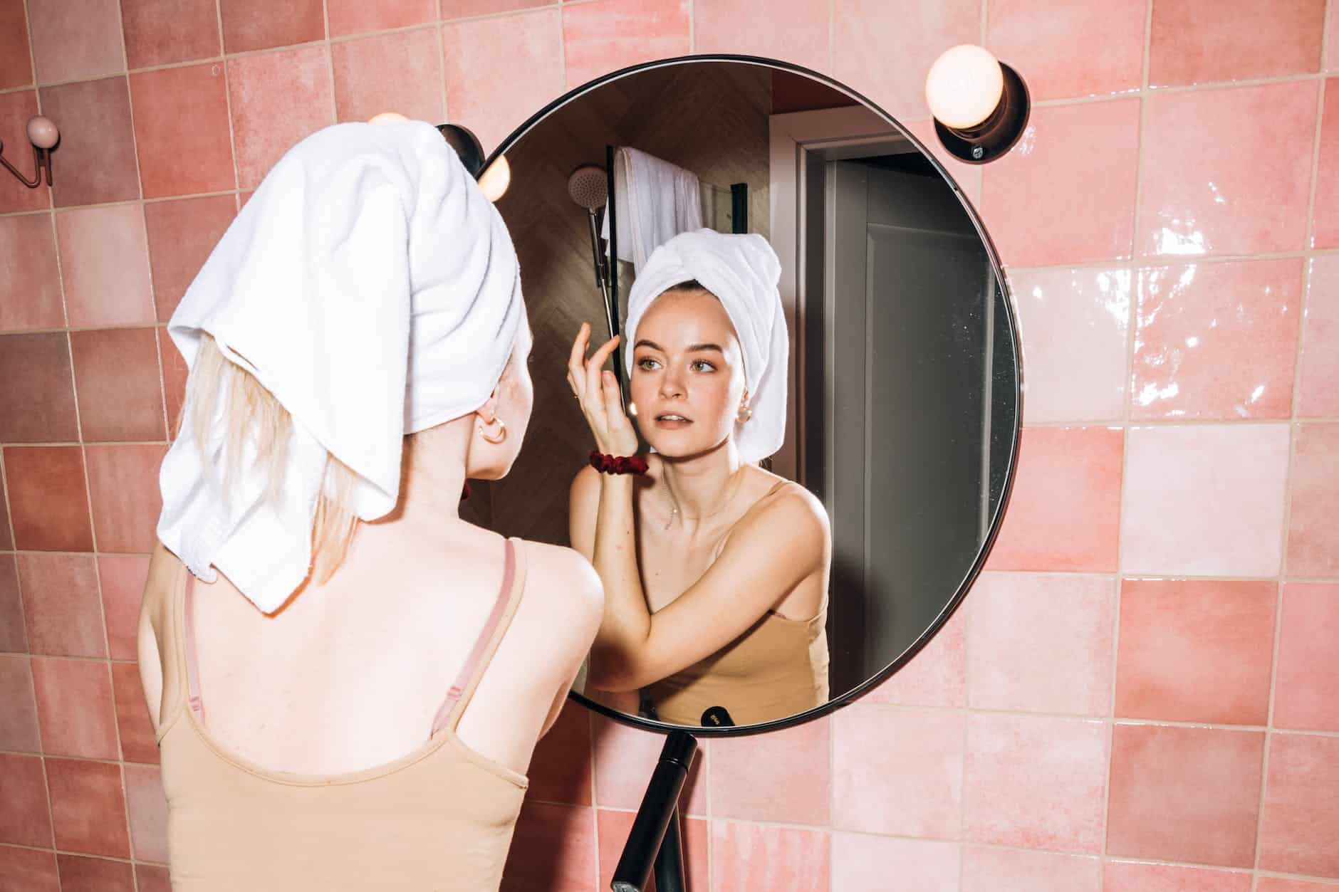 young woman doing her facial skin care