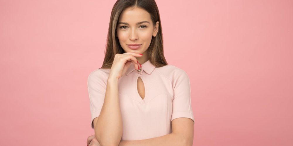 woman wearing pink collared half sleeved top