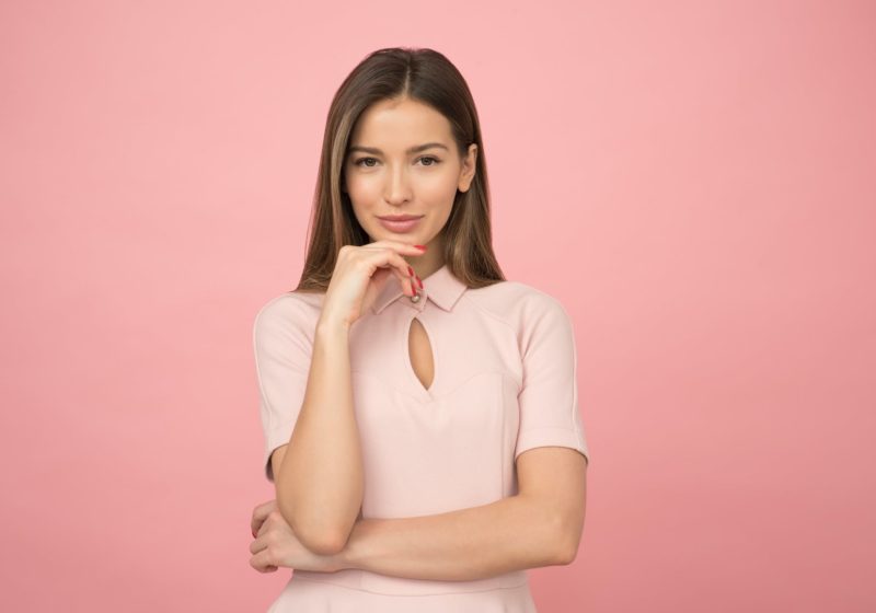 woman wearing pink collared half sleeved top