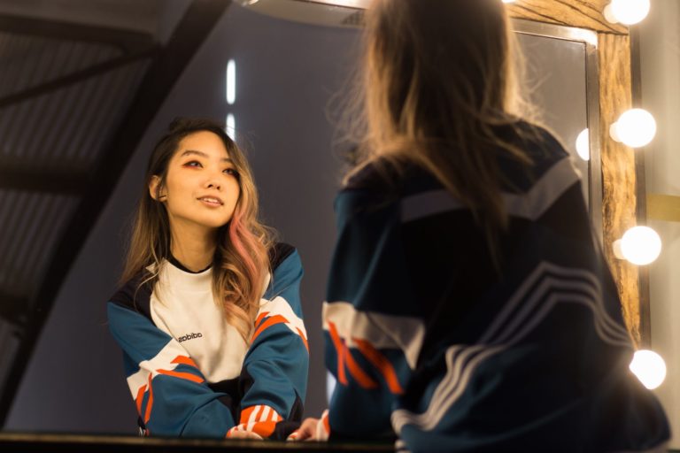 woman wearing blue and white sweatshirt