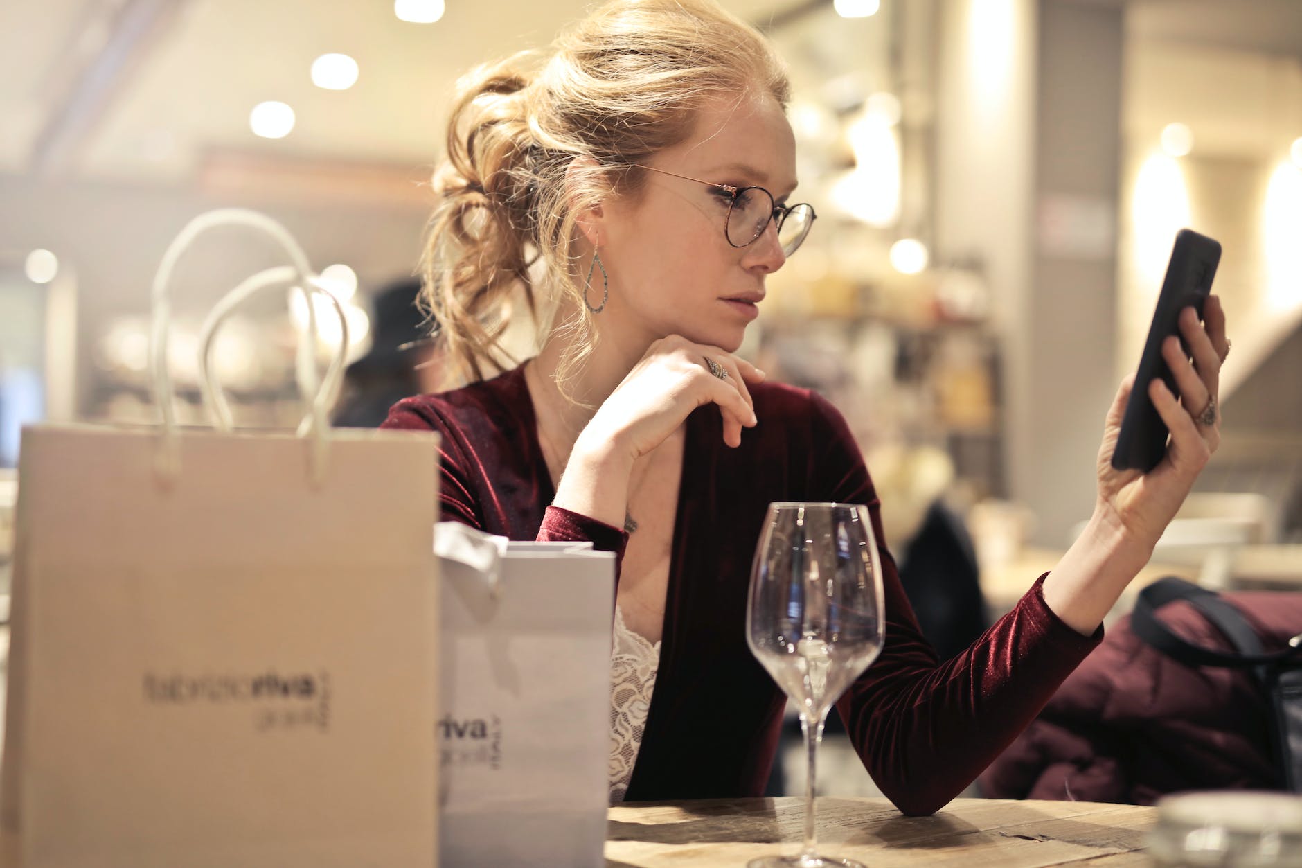 photo of woman holding her phone