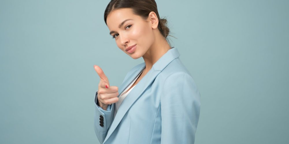 woman wearing blue shawl lapel suit jacket
