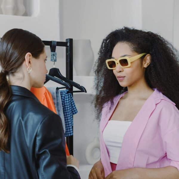 woman in pink long sleeve top wearing sunglasses
